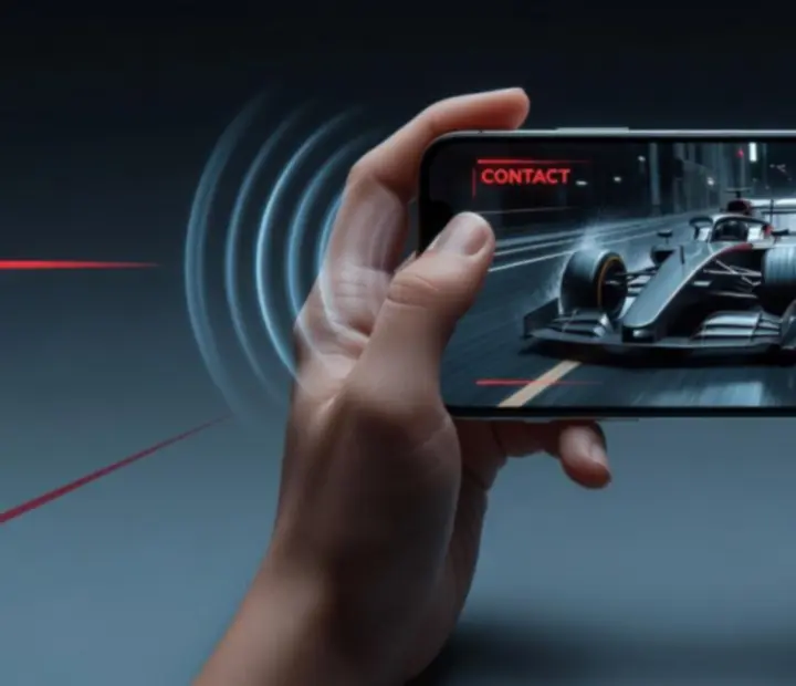 Mobiltelefon, amelyen haptikus rezgés és vizuális effekt kíséri a Racing Go versenyét